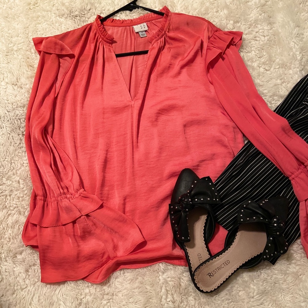 Cute light ruffle shirt.